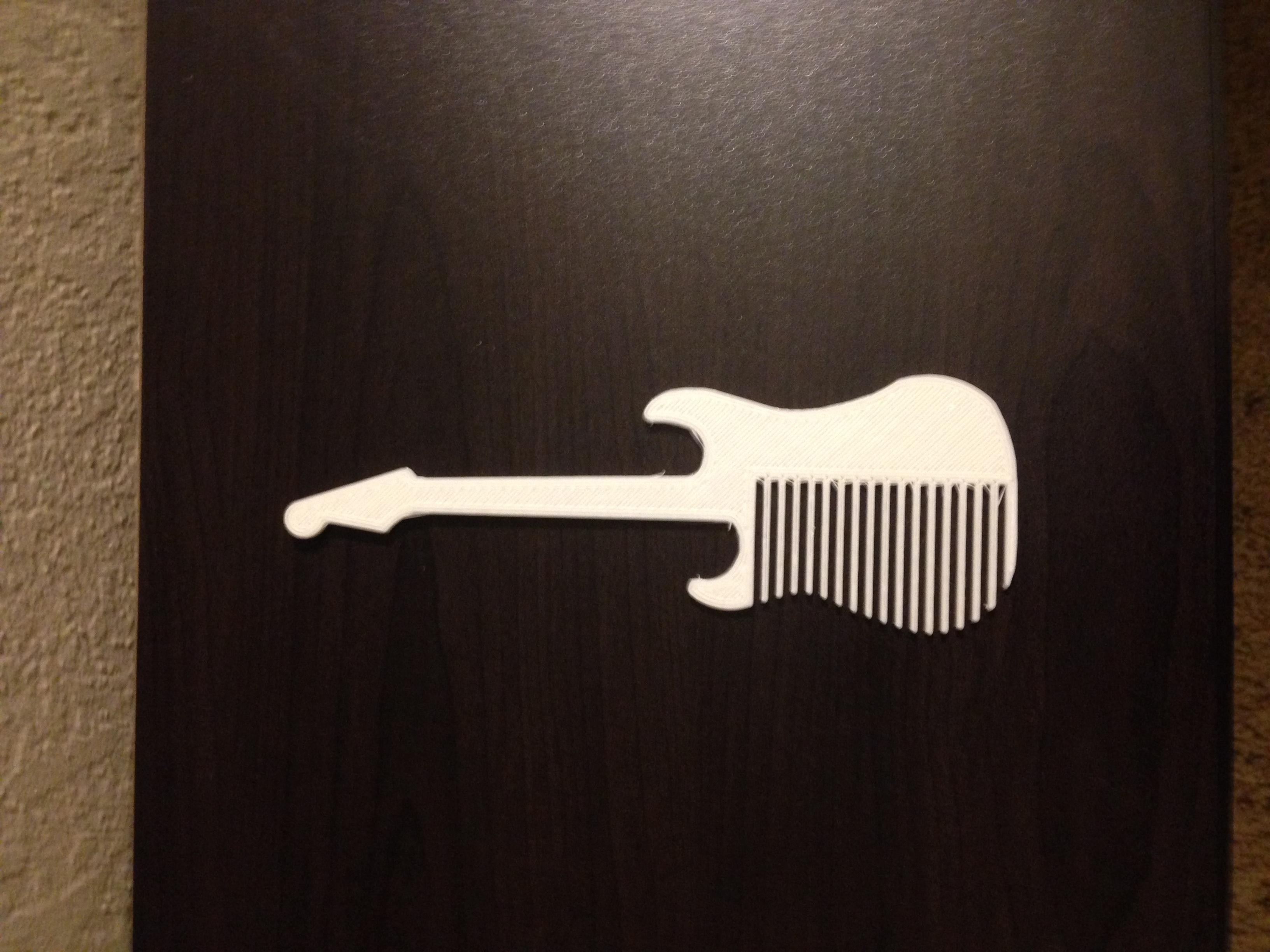 Combcaster : A comb based upon the famous guitar.